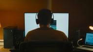 Matthew sits at a computer, symbolizing surveillance and obsession (Image via YouTube/MUBI)